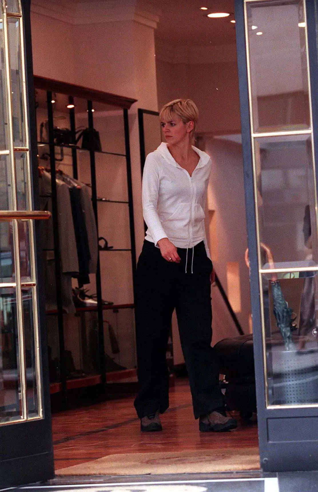 Zoe Ball visits designer boutiques in Knightsbridge, dressed casually in a white hooded top and black trousers.