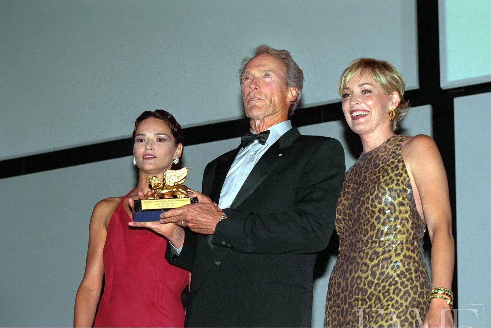 Celebrities Chiara Caselli, Clint Eastwood, and Sharon Stone attend the Venice International Film Festival.