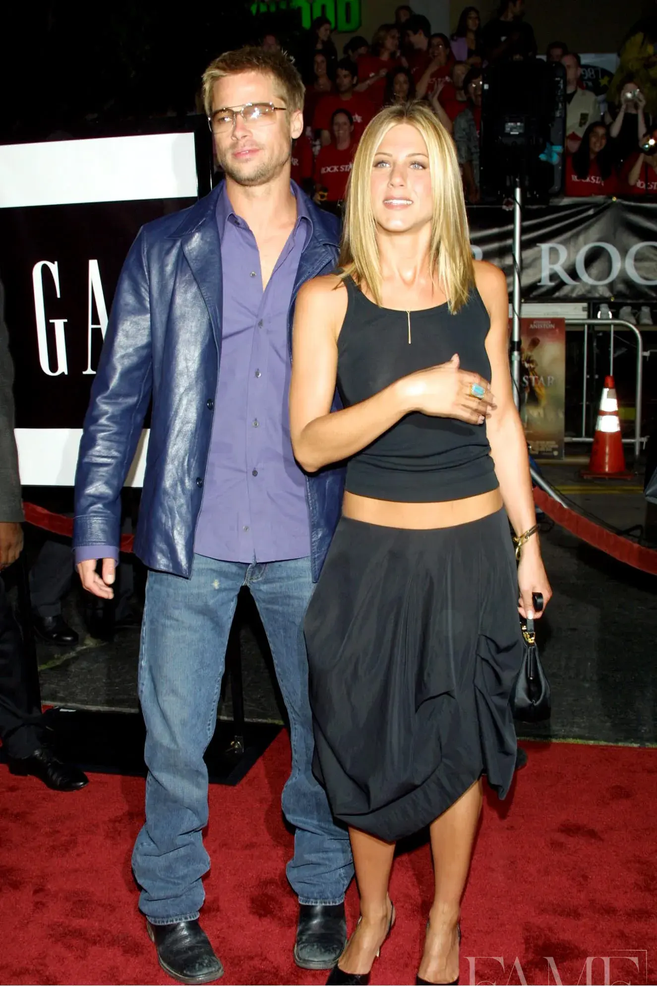 Brad Pitt and Jennifer Aniston standing together on the red carpet at the Rock Star premiere in 2001