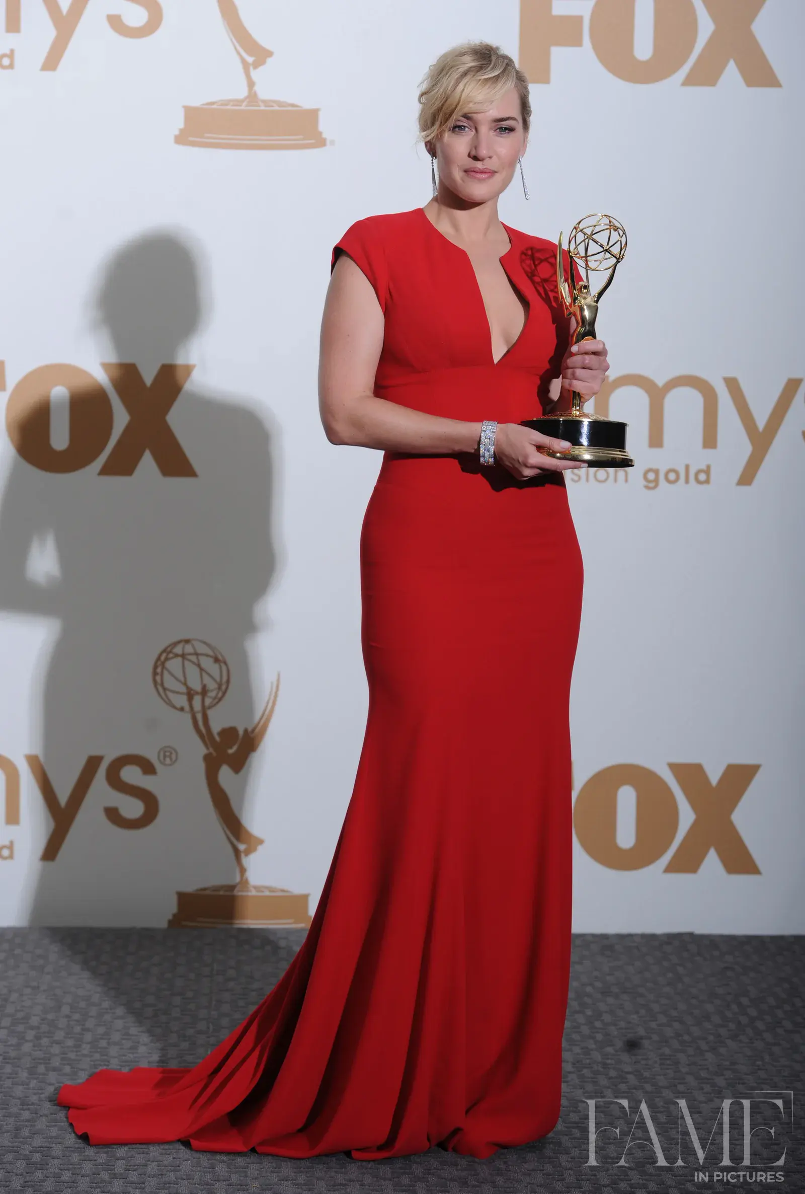 Kate Winslet holding her Emmy award in Los Angeles in 2011