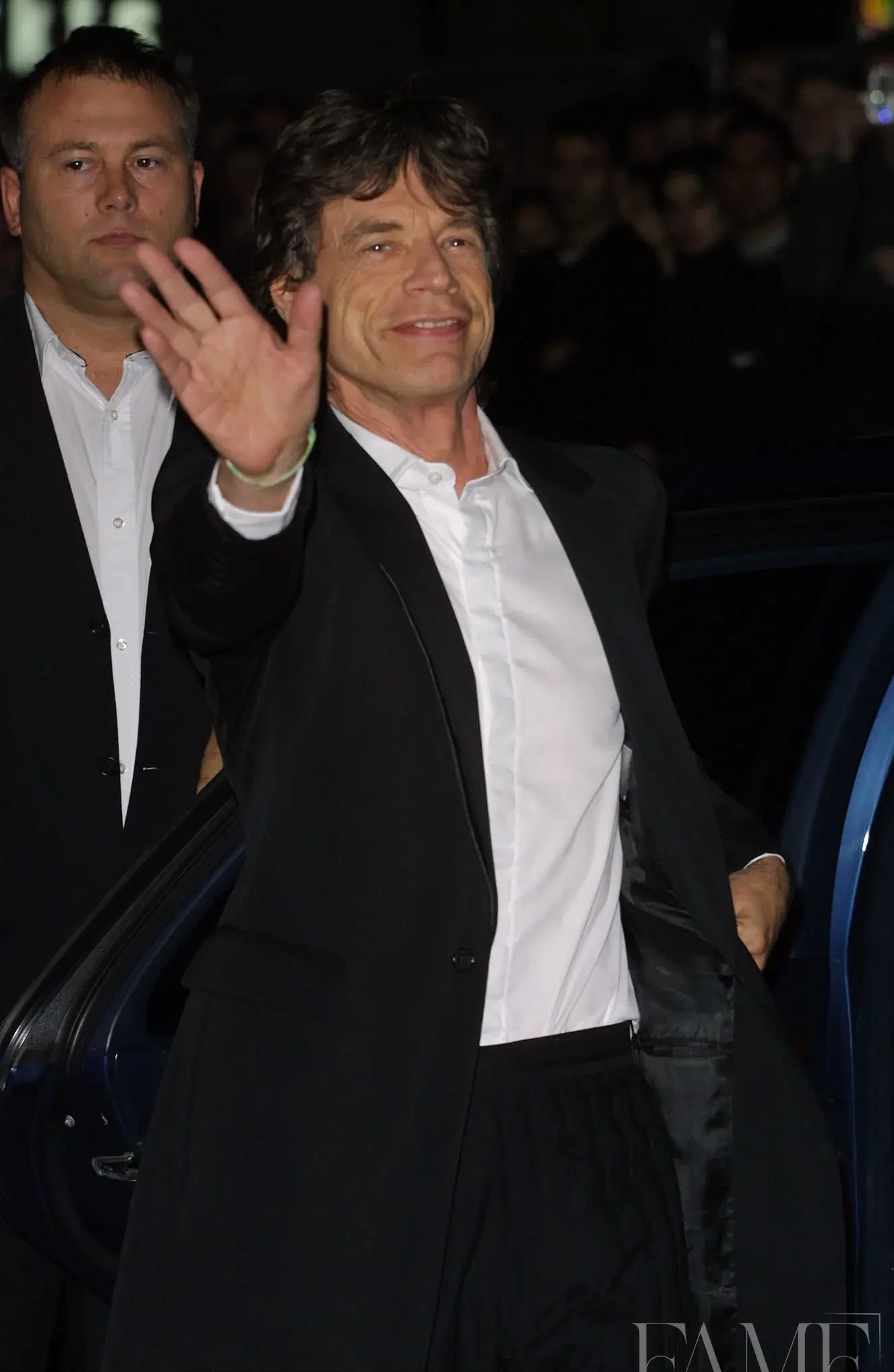 Mick Jagger waving at the Enigma premiere in London in 2001