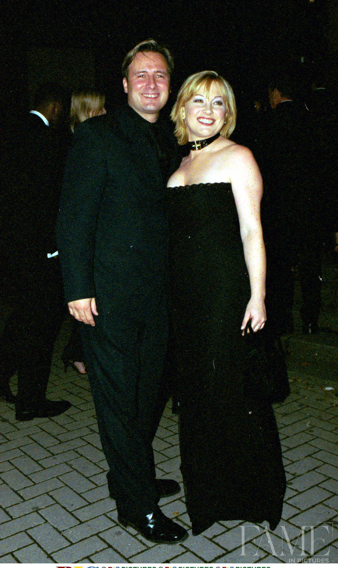 Wendy Turner and Gary Webster standing together in dark evening clothes outside the venue