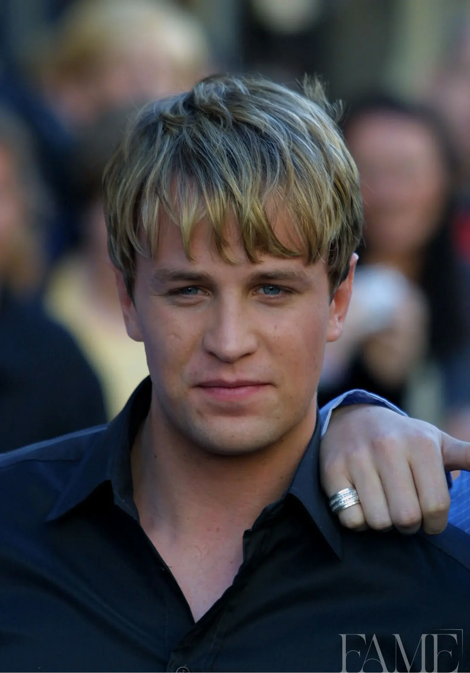 Kian Egan with highlighted hair and a dark shirt at the Westlife album launch